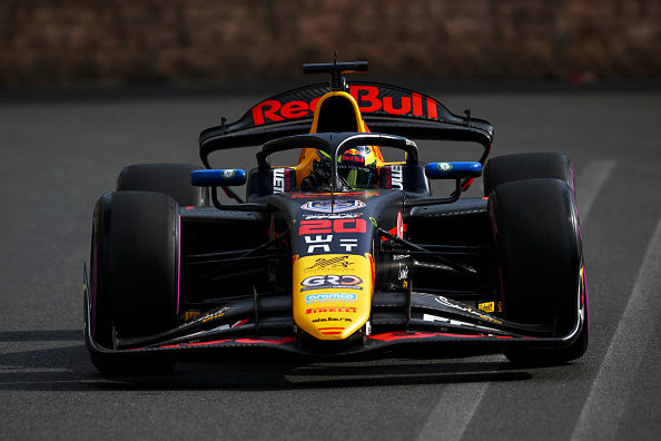 black, yellow, and blue Red Bull race car